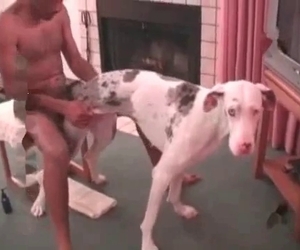 African American male is banged by a white puppy